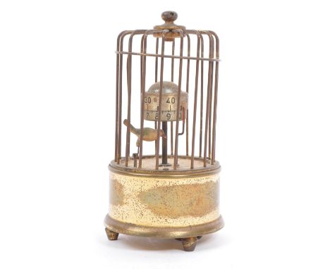 A mid 20th century circa 1950s &nbsp;clock modelled as a bird in a brass cage. A&nbsp;brass case cage clock with keyless wind