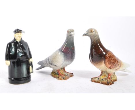 Beswick - Two 20th Century porcelain china Beswick figures in the form of pigeons, both stood on a grass base with stamp to b