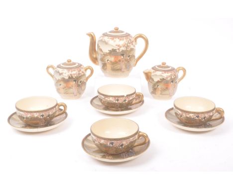 A 20th Century Japanese Satsuma hand painted ceramic tea service to include teapot and four teacups and saucers. Depicting Ja