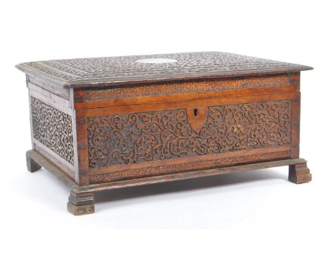A vintage 20th century Kashmiri carved camphor wood box. With dense foliate repeating carved patter. Rectangular form with hi