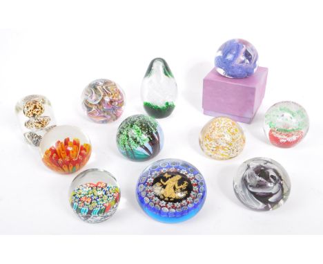 A large collection of assorted mid century / vintage studio art glass paperweights. Comprising of multi coloured controlled b