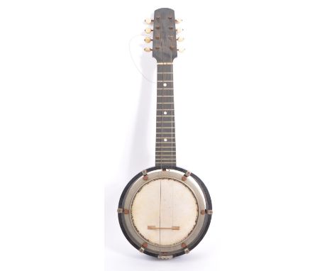 A vintage early 20th century eight string banjo. The banjo having a wooden body and neck, with brass inlay frets. With open b