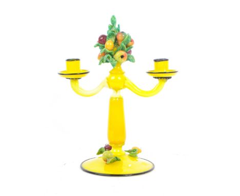 A vintage 20th century Murano / Venetian manner art glass candelabra / candle stick. The candelabra having two scrolled arms 
