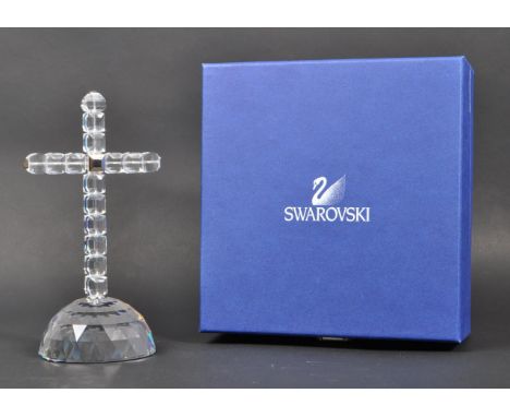 Swarovski - A boxed Swarovski cross of light decorative ornament. The ornament in the form of a crucifix atop a faceted domed