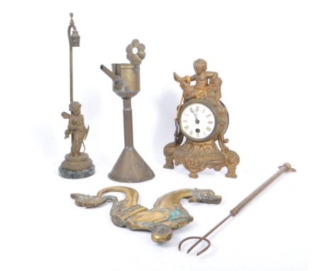 A collection of assorted 20th century brass decorative items. The collection to include a cast brass mantel clock, featuring 