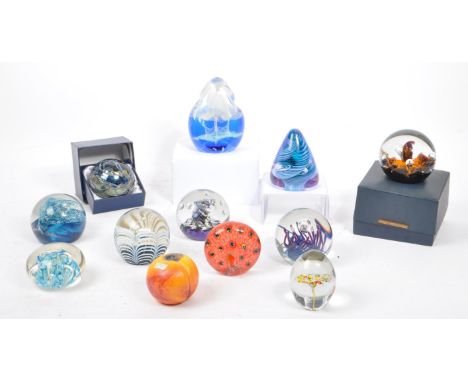 A large collection of assorted mid century / vintage studio art glass paperweights. Comprising of multi coloured controlled b