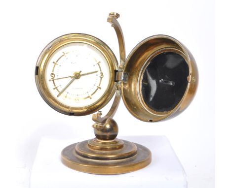 Europa - Seven Jewels - A vintage 20th century desk top clock in the form of a globe. With stepped circular base and wind up 