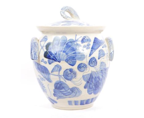 A vintage 20th century English ceramic blue &amp; white lidded jar / pot. Having a formed shape handled top, with matching si