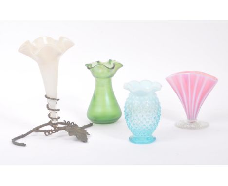 A collection of 20th Century small four glass vases in the style of vaseline and loetz. To include a green vase with scallope