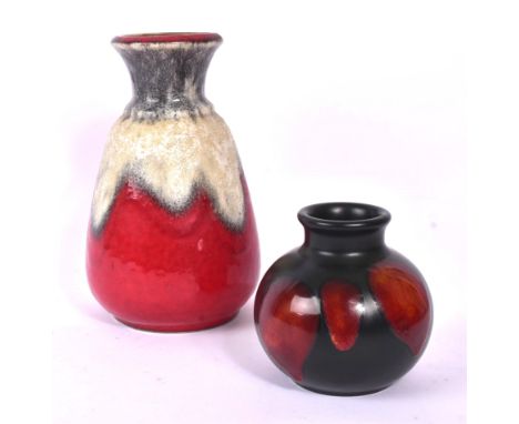 Two mid 20th century ceramic vases. The lot to include a 20th century Poole Pottery 'galaxy' glaze short vase / pot, alongsid