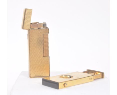 Dunhill - A 20th century Dunhill Swiss made cigarette lighter. The lighter having engine turned finish. Marked Dunhill, Made 