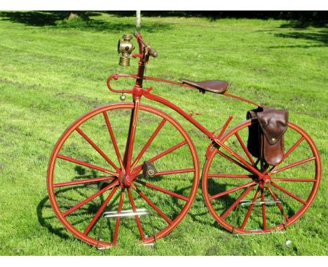 *A circa 1869 Vélocipède. Finished in a pleasant shade of red with cream lining to the wheels and both fork stays, the front 