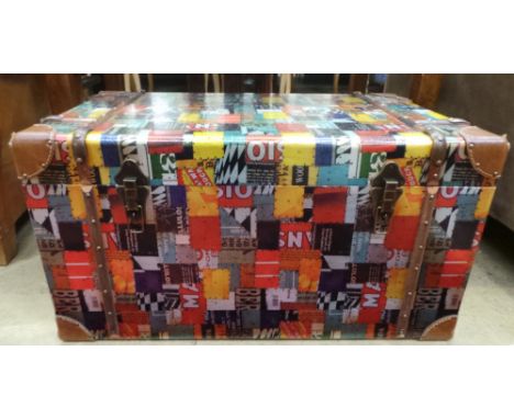 A contemporary aluminium bound trunk with a polychromatic motif design