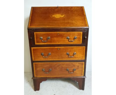 An Edwardian inlaid mahogany bureau with bracket feet