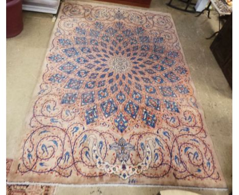 A fine North East Persian meshad carpet 340cm x 245cm, central medallion surrounded by stylised motifs on a camel field