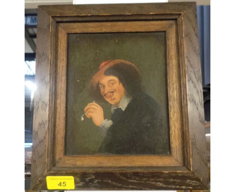 A 20th Century oil on panel after Frans Hals, depicting a portrait of a smoking cavalier in period costume, unsigned and fram
