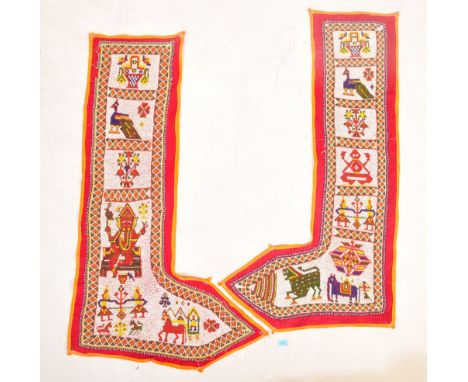 A pair of vintage hand made Indian beadwork wall hanging. Of L shape form, with Ganesh, peacock, floral decoration with a red