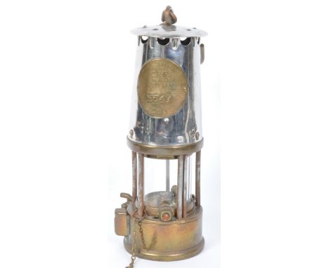 An early 20th century brass and metal Welsh miners lamp having hook atop with makers plaque to centre. Patent no. 3547. Measu