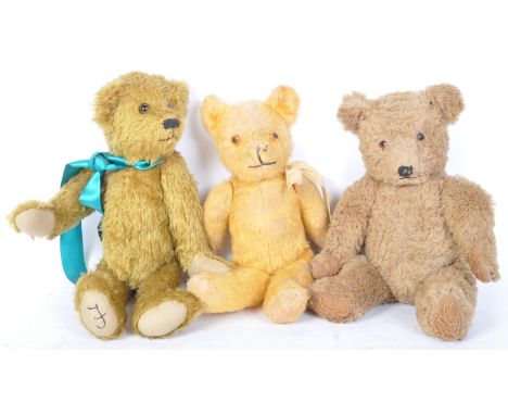 A collection of three vintage 20th century teddy bears all having moving limbs with red beaded eyes.&nbsp;