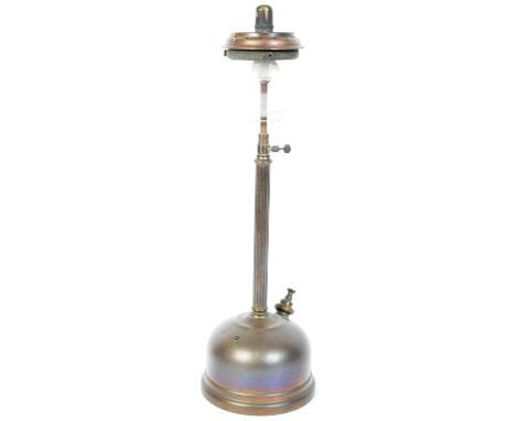 An early 20th century paraffin oil lamp in the form of a street lamp post raised on a reeded metal column atop circular base.