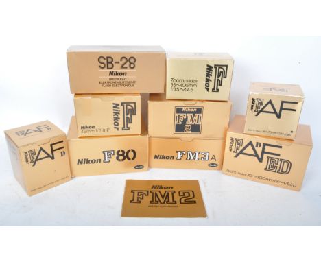 A collection of nine vintage original Nikon camera boxes. To include boxes for Nikon FM3a, Nikkor FADFE, Nikon FM2, Nikon SB 