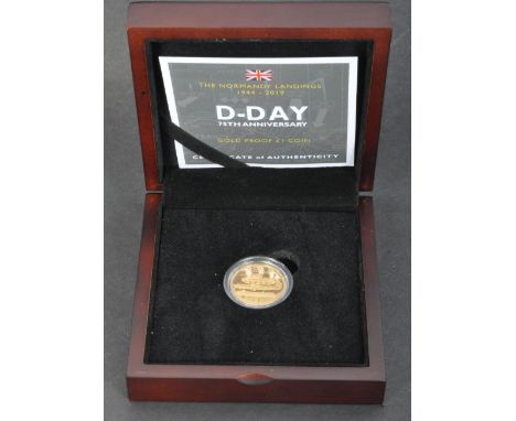 A 2019&nbsp;Guernsey D-Day 75th Anniversary £1 22ct Gold Proof Coin. Featuring image of a tank, Bomber plane and landing craf