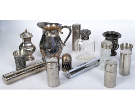 A collection of vintage 20th Century metal and silver plate glassware. To include; vanity items, jugs, scent bottles, jar, sh