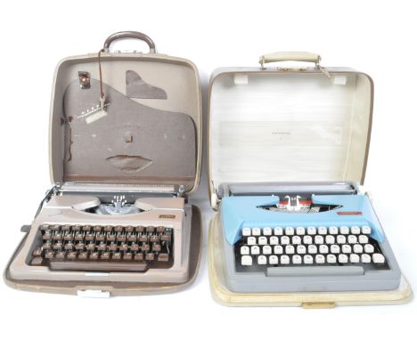 Two vintage 20th century typewriters to include Royal Challenge and a Pilot. Both in cases. Measures 10cm x 33cm x 31cm.
