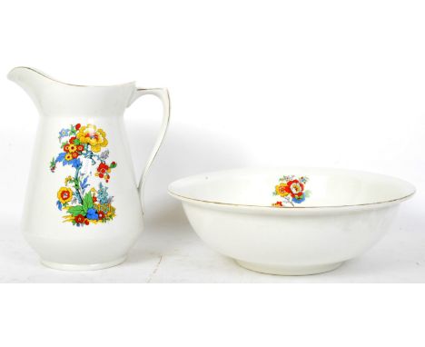 A vintage 20th century ceramic wash set decorated with transfer printed polychrome flowers. The set to include water bowl &am