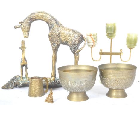 An assortment of vintage 20th century decorative brass items to include a brass and onyx candelabra, two Indian brass footed 