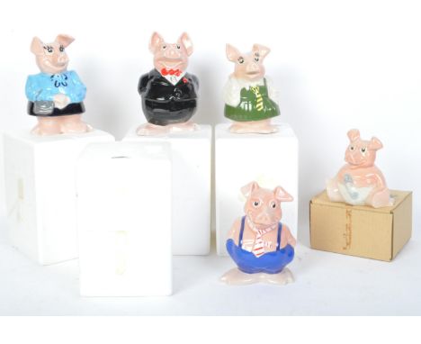 A collection of vintage 20th century Natwest ceramic pig money banks. All held within original packaging with original stoppe