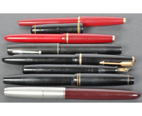 A collection of seven vintage 20th century fountain pens comprising of Parker Watermans, Four having 14K gold nibs.