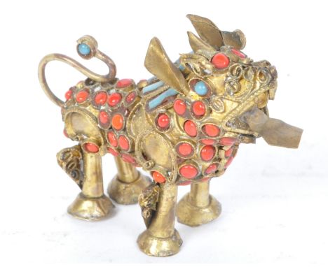 A vintage 20th century Tibetan Nepalese brass &amp; cabochon coloured glass foo/phoo dog. The foo dog having an open mouth ov