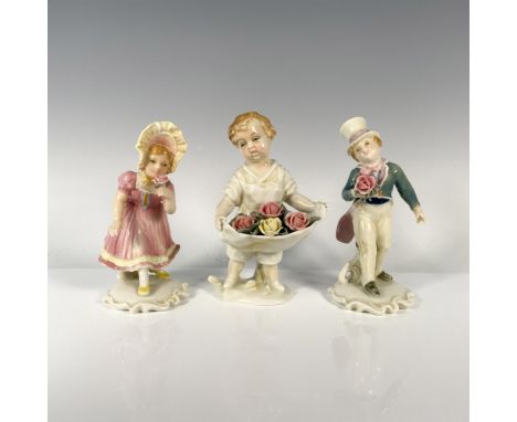 A set of 3, with a dapper boy in white and green tuxedo, a delightful girl in pink sundress and yellow hat, and another child