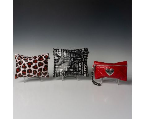Black, white, and red cotton twill bags with clear PVC overlay. Smallest red bag has silver heart medallion stamped with joy,