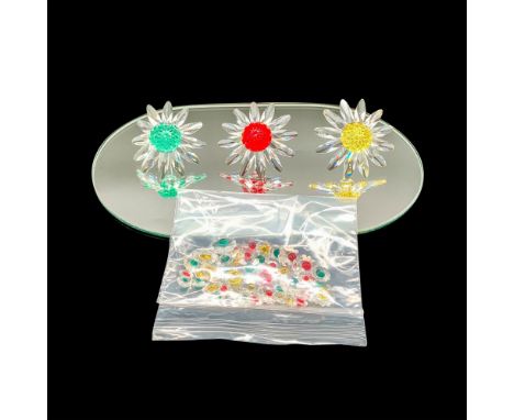 A collection of the 4 pieces of the Swarovski marguerite set which include, the red 252371, yellow 229778, and green 227537 m