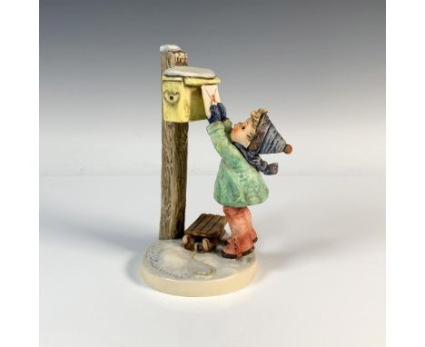 Hand-painted figure of a boy in winter attire putting a letter into a mailbox. M.I. Hummel impressed. Goebel backstamp. Issue
