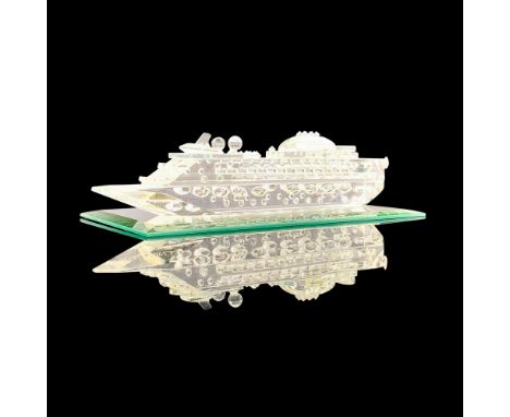 A clear crystal figure of a cruise ship in exquisite detail with multiple raised points and laser text that reads Emerald Pri