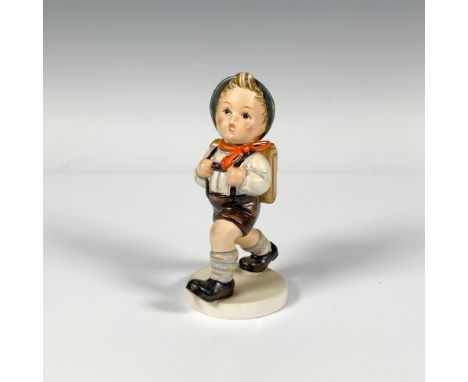 A young boy walking to school wearing traditional attire and carrying a backpack. M.I. Hummel impressed. Goebel backstamp Iss