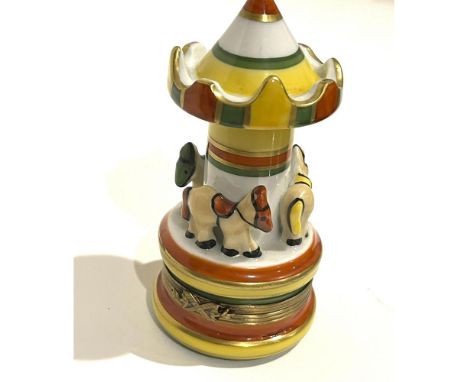 Step right up to the whimsy and fantasy of an amusement park carousel in miniature. Meticulously hand painted to captivate co