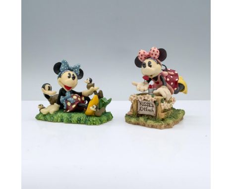 Minnie in a pink apron and bow, running a kissing booth that reads Kisses 10 cents each, while the other portrays her sitting