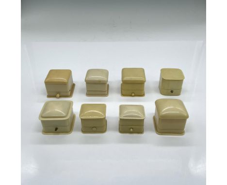 Eight small ring boxes, some with original satin store name/logo in the lid; velvet ring holder. The largest is 1.75"L x 1.5"