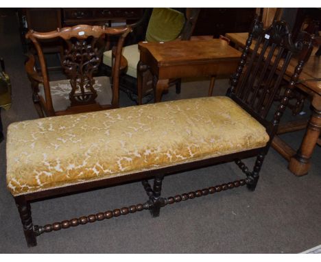 A Victorian carved oak day bed with bobbin turned stretchers, 153cm long 