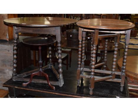 A circular cricket table with later top on bobbin turned legs, 84cm diameter; a small drop leaf table; and a George III style