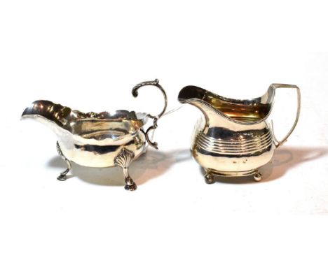 A George III silver sauceboat and a George III silver cream-jug, the first by William and James Priest, London, 1768, the sec