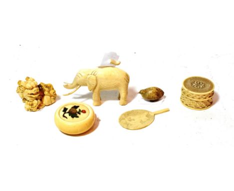 Late 19th/early 20th century: An ivory netsuke; an ivory small elephant (damaged trunk); an ivory patch box; an ivory ornamen