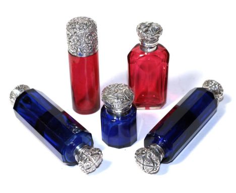 Three silver mounted blue glass scent bottles; and two silver mounted ruby glass scent bottles (5)   Glass scent bottles with
