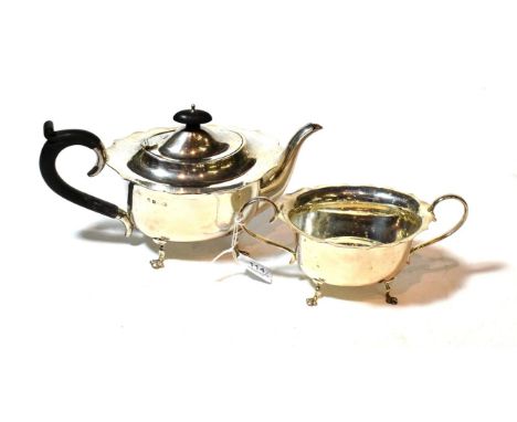 A George V silver teapot and sugar-bowl, maker's mark probably BBS, Birmingham, 1922, each oval and on four trefoil feet, the