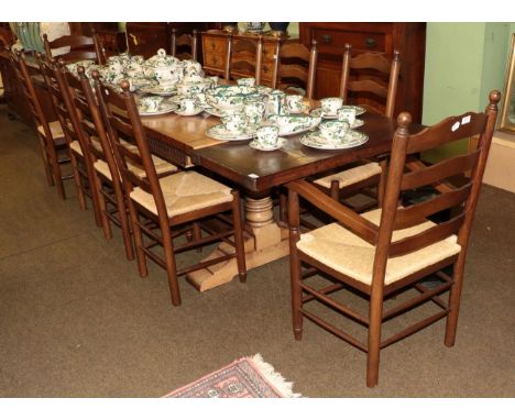 A set of ten reproduction oak and rush seated ladder back chairs (including two carvers)
