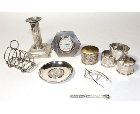 A collection of silver, including: a George V silver-mounted timepiece, by Adie Brothers, Birmingham, 1928; four various napk